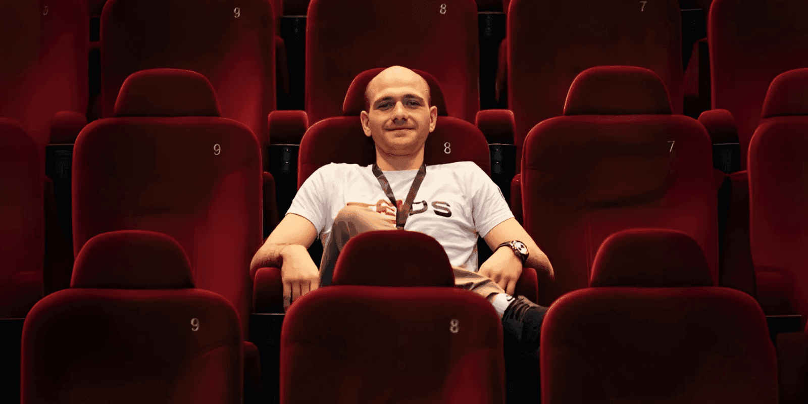 "Student in a cinema seat representing M3DS Academy's personalized mentorship and flexible 3D art education."