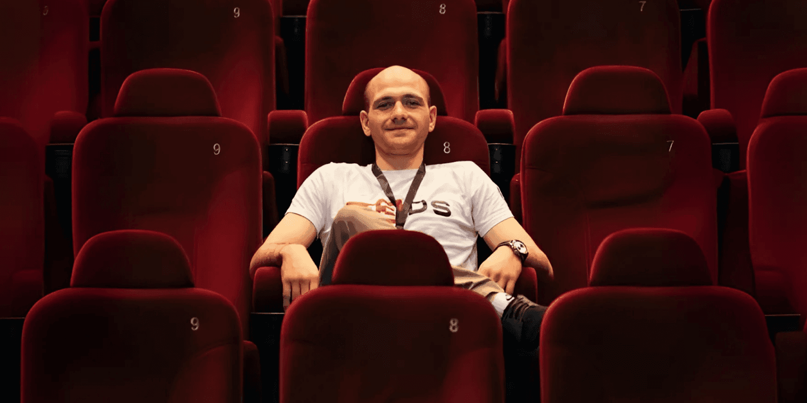 "Student in a cinema seat representing M3DS Academy's personalized mentorship and flexible 3D art education."