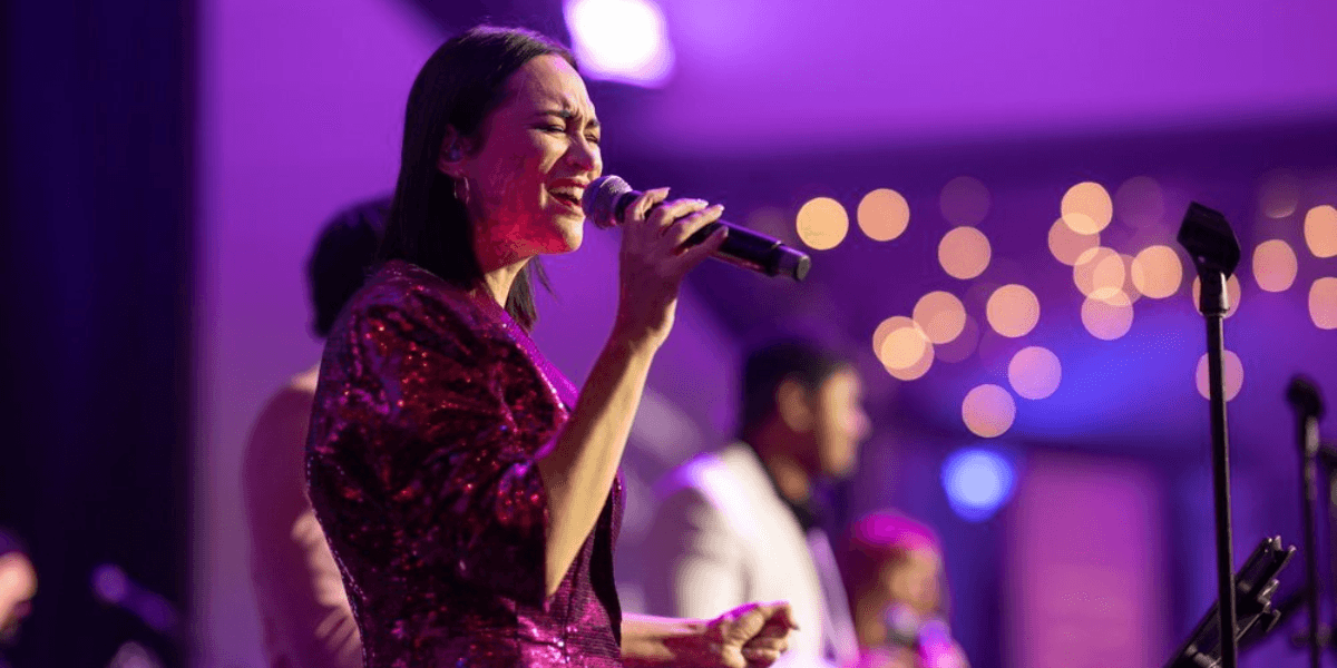 Singer performing at a luxury event, with McGee Entertainment’s world-class music setting the atmosphere.