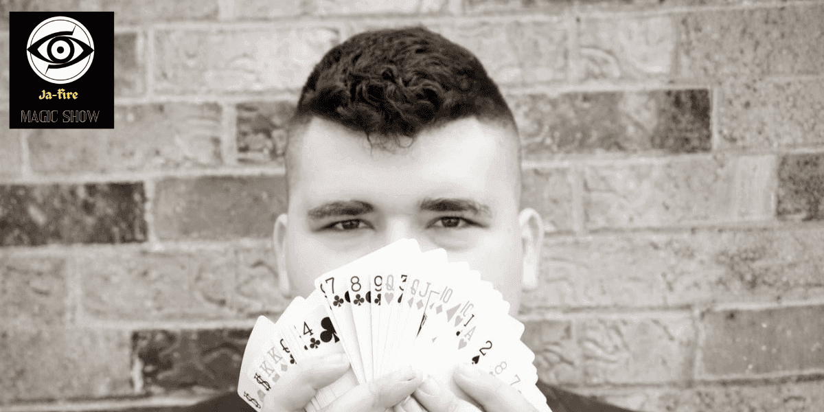 Ja-Fire showcasing his original card tricks, pushing the limits of magic performance.