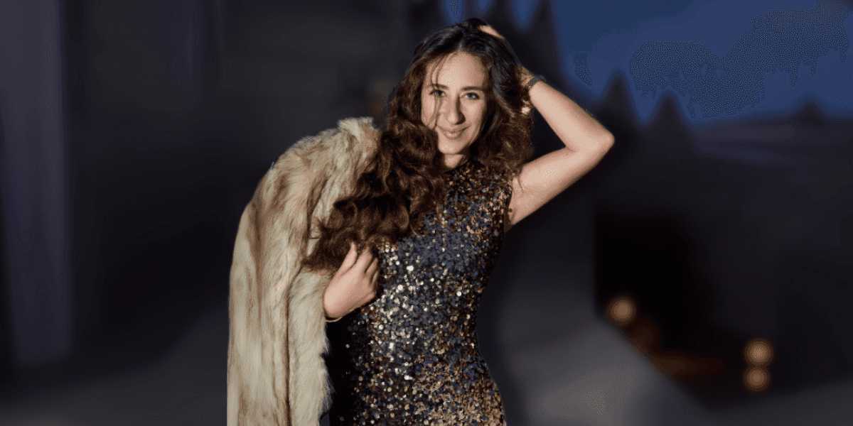Irma Davarashvili in sequin dress and fur coat after winning Global “Women in Sport” Award in London.