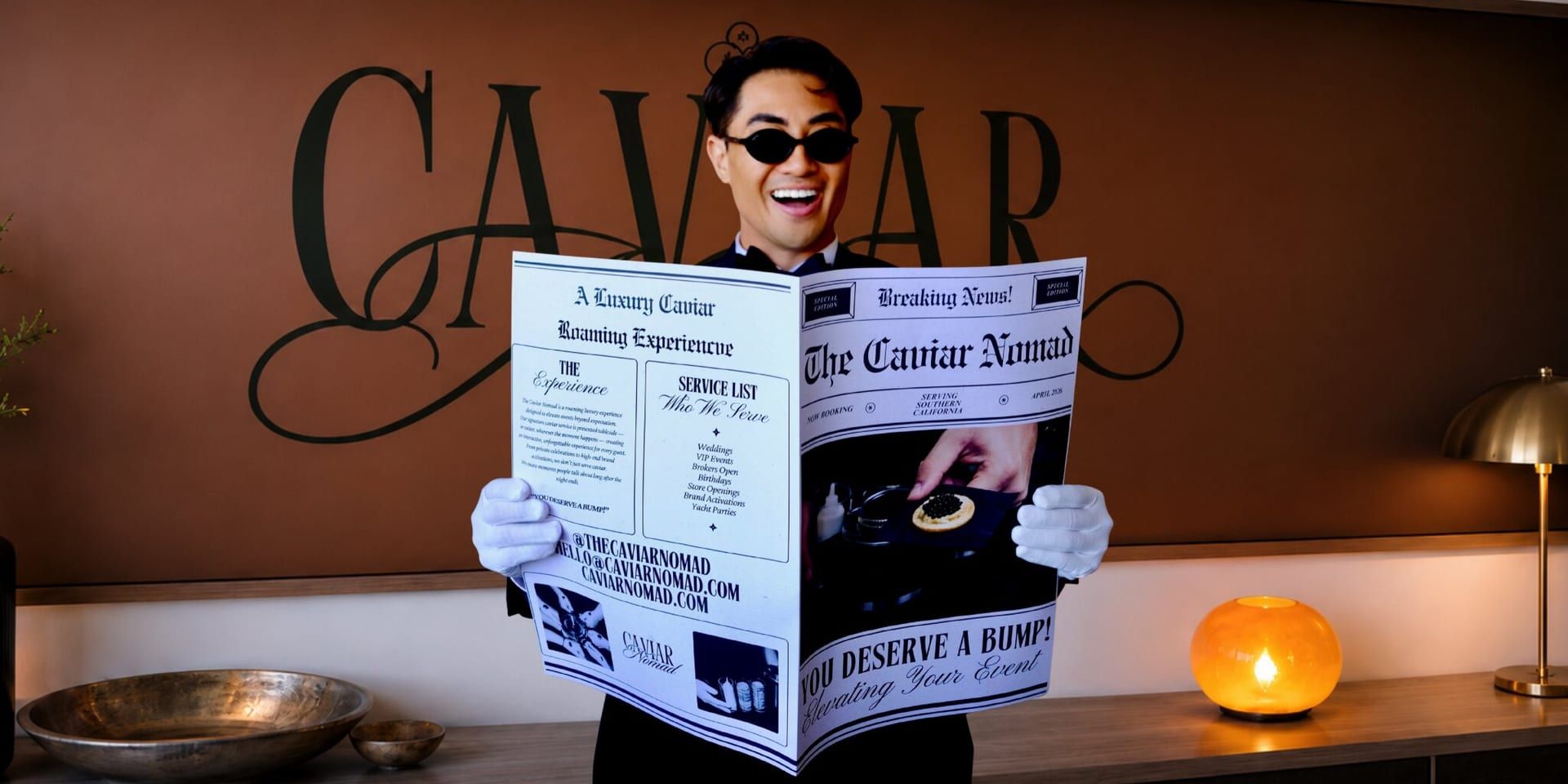 The Caviar Nomad host holding branded newspaper promoting a luxury roaming caviar experience.