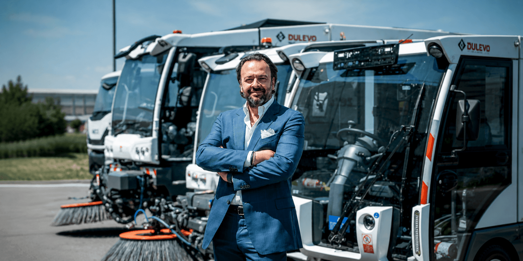Umberto Maria Cini stands before Dulevo street sweepers at the company's manufacturing facility in Italy.