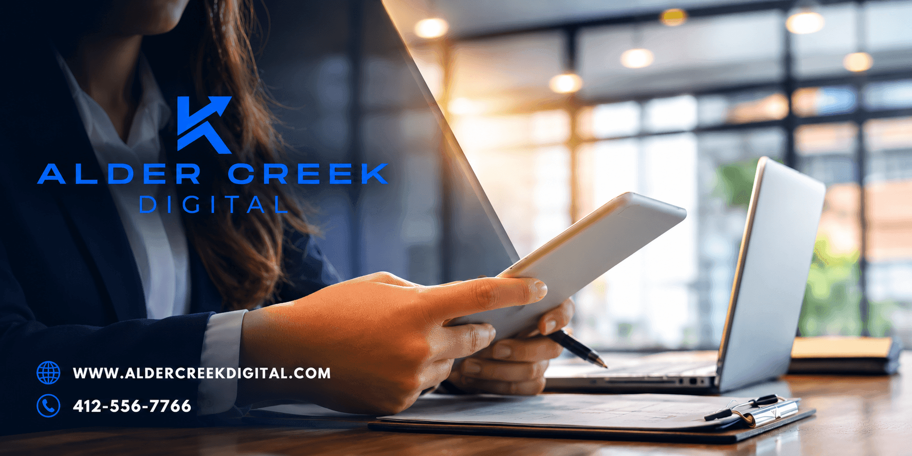 Alder Creek Digital branding with professional using a tablet beside a laptop.
