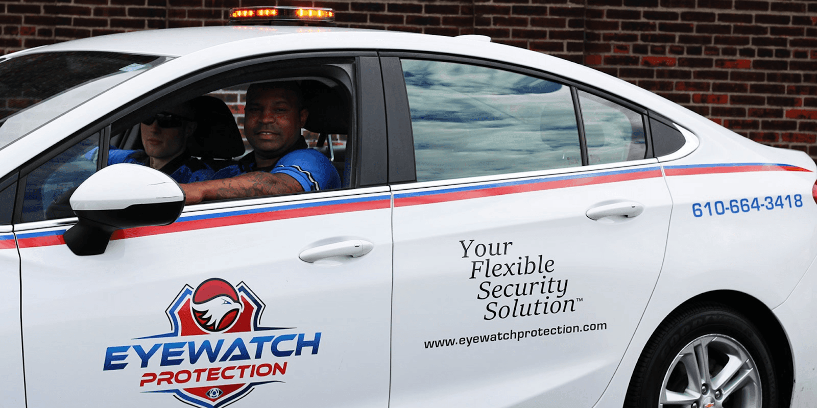 Eyewatch Protection security guard driving a branded vehicle, providing flexible security solutions with mobile patrol services for clients.