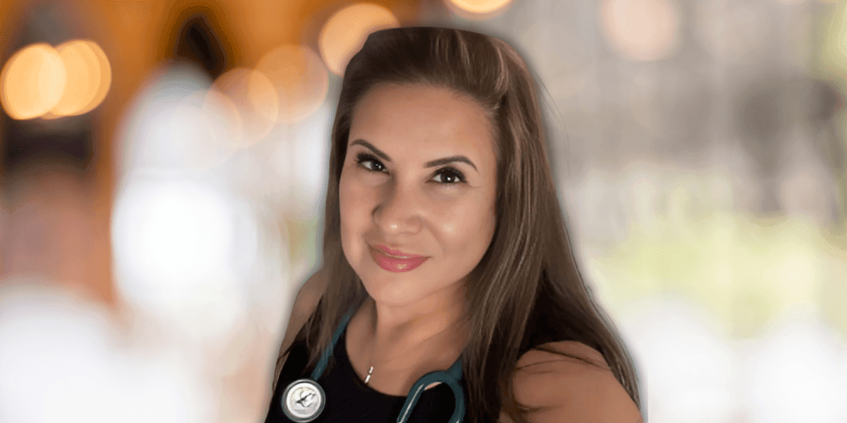 Celeste Albanez, founder of Balanced Health For Women, smiles confidently while wearing a stethoscope around her neck. As a nurse practitioner, she is dedicated to offering personalized telemedicine services that support women’s health, including weight loss and menopause management. Her approach combines affordable, customized care with a holistic focus on wellness, making it accessible to women nationwide.