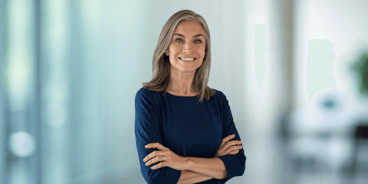 Dr. Dorota Novitskie, forensic psychologist, standing confidently with arms crossed in a professional setting, reflecting empathy and accountability in her work.