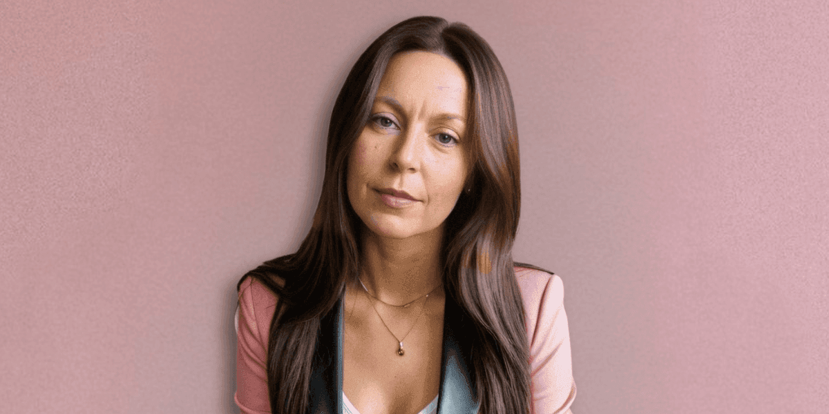 A professional portrait of Dr. Millie Lytle, a naturopathic doctor and energy medicine expert, with long brown hair.