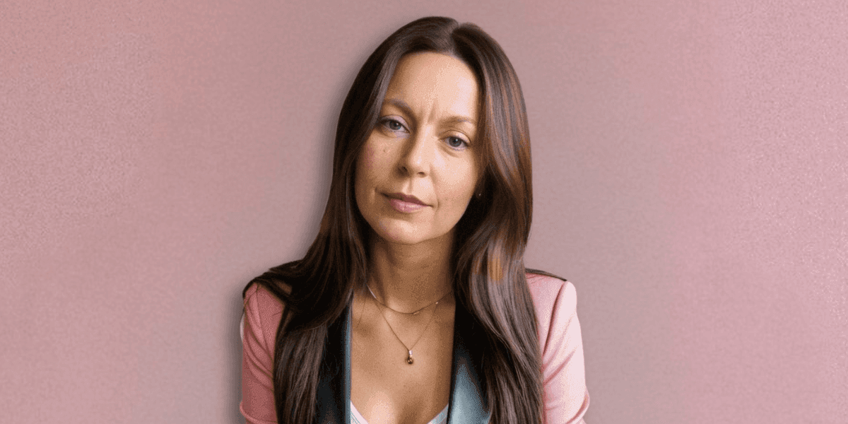 A professional portrait of Dr. Millie Lytle, a naturopathic doctor and energy medicine expert, with long brown hair.