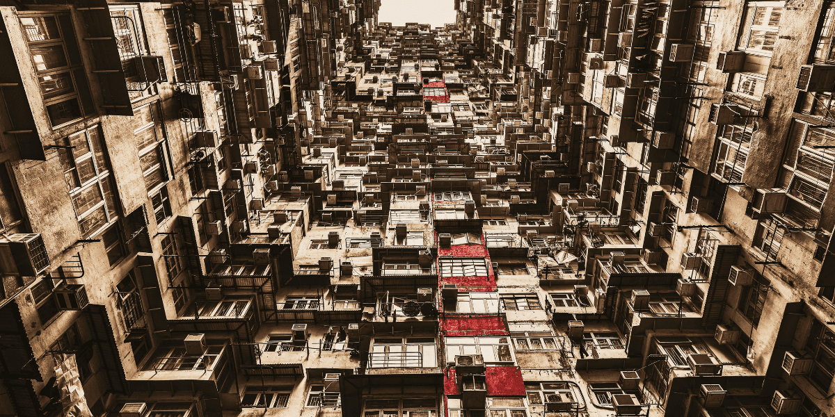 Abstract architectural photograph with layered apartment buildings and highlighted red balconies.