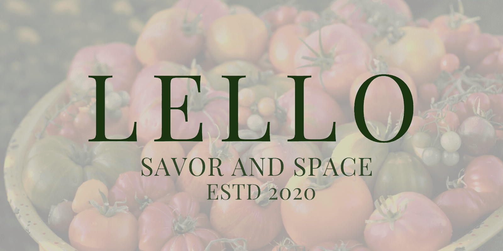 A bowl filled with ripe tomatoes, accompanied by the words "lello," "savor," and "space" in an elegant font.
