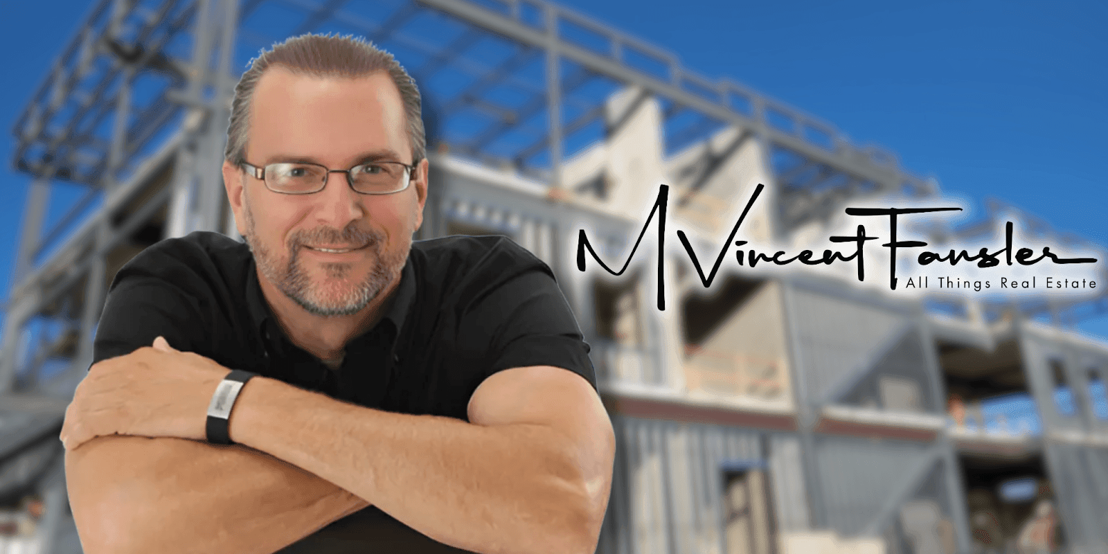 Smiling man in glasses poses in front of a modern building under construction with "M Vincent Fansler" logo.