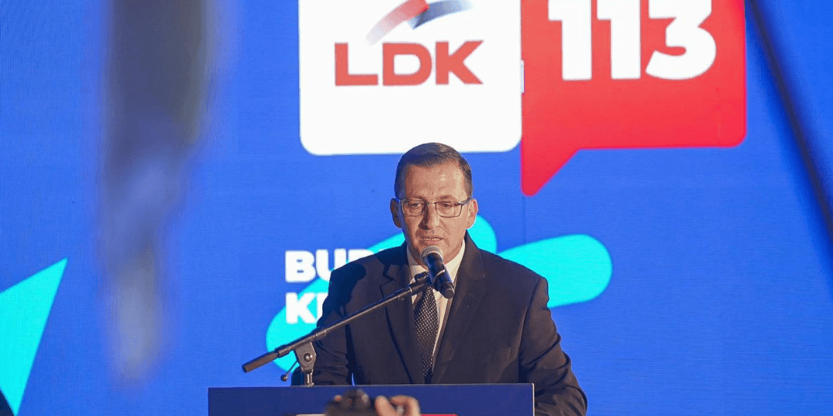 Burim Krasniqi speaking at a public event, advocating for sustainable growth and infrastructure improvements in Rahoveci.