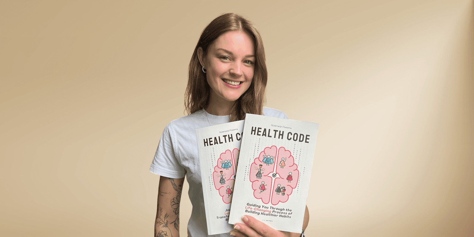 Rozemarijn Postema holds two copies of 'Health Code,' promoting AmiVital’s science-backed approach to consistent health and wellness.